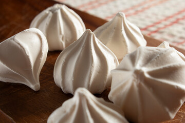 A view of a pile of meringue cookies.
