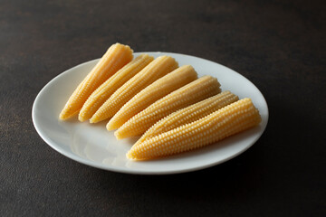 A view of a plate of baby corn.