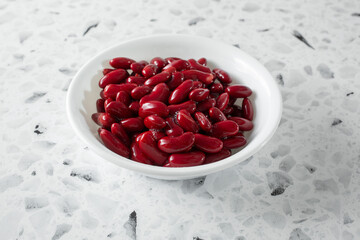 A view of some red kidney beans, in a bowl.