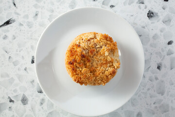 A top down view of a mini apple pie.