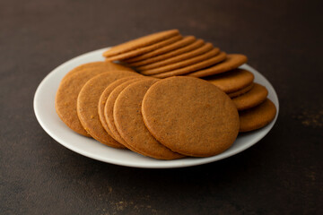 A view of a plate of ginger snap cookies.