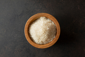 A top down view of a bowl of agar agar flakes.