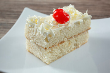 A view of a slice of white cake.