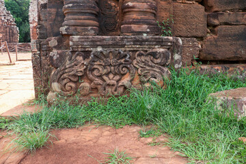 Close-up of the base of a stone column with elaborate carvings, a testament to Jesuit art in the...
