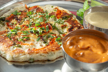 A closeup view of a plate of uttapam.