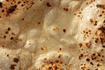 A top down view of tava chapati, as a background.