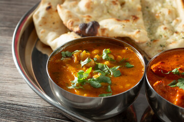 A view of curry bowls, part of an Indian food platter.