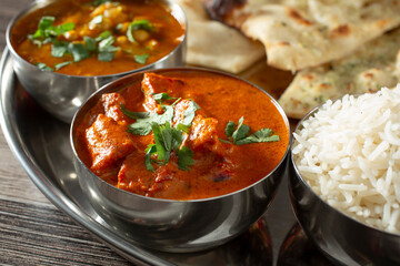 A view of curry bowls, part of an Indian food platter.