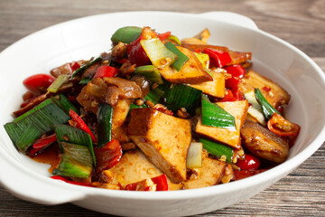 A view of a pork and bean curd entree.