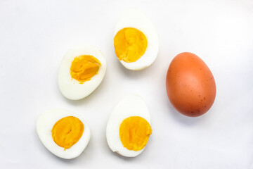 several halved boiled eggs isolated on white background