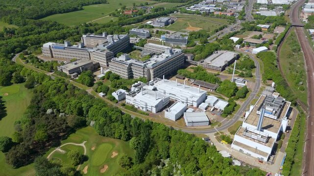 Aerial drone industrial area buildings GSK Stevenage sunny Spring day UK England factory manufacturing pharmaceuticals 