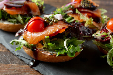 A closeup view of some lox bagels.