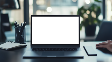 Professional Workspace with a Laptop on Desk Featuring Transparent PNG Cutout Screen and Notepad Nearby