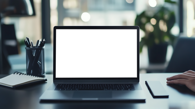 Professional Workspace with a Laptop on Desk Featuring Transparent PNG Cutout Screen and Notepad Nearby