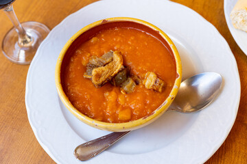 Patatas revolconas, stirred potatoes with paprika and fried bacon, typical dish for Spanish communities of Salamanca and Extremadura
