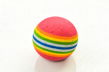 Colorful ball rough and scratched with back light isolated on white background.