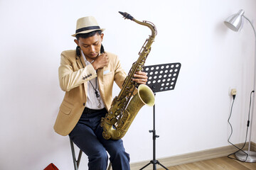Musician Man Wear Hat And Formal Suit Adjusting Saxophone Neck Strap Before Playing