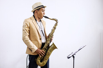 Young Asian Jazz Musician Playing The Saxophone