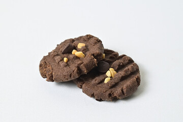 Close up view of two cookies with peanut and chocolate chips. Freshly Baked Homemade. perfect for bakery advertisements and dessert menus. Clipping path. Close up. Stack. Pile.