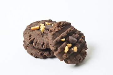 Close up view of three cookies with peanut and chocolate chips. Freshly Baked Homemade. perfect for bakery advertisements and dessert menus. Clipping path. Stack. Pile. Isolated on white background.