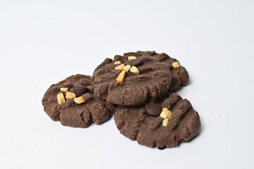 Close up view of four cookies with peanut and chocolate chips. Freshly Baked Homemade. perfect for bakery advertisements and dessert menus. Clipping path. Stack. Pile. Isolated on white background.
