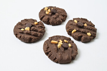 Close up view of four cookies with peanut and chocolate chips. Freshly Baked Homemade. perfect for bakery advertisements and dessert menus. Clipping path. Isolated on white background.