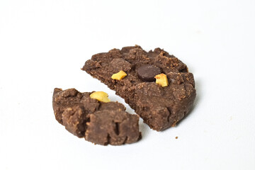 Close up view of broken cookies with peanut and chocolate chips isolated on white background. Freshly Baked Homemade. perfect for bakery advertisements and dessert menus. Clipping path.