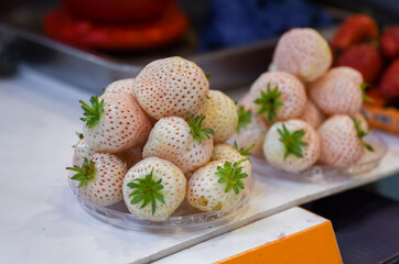 Fresh white strawberries on display at a local Shanghai market.