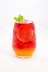 vibrant red citrus cocktail with blood orange slice and fresh mint served in clear glass over ice...