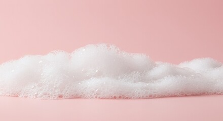 Serene White Foam with Delicate Bubbles on Smooth Pale Rose Pink Surface for Cosmetic Background and Gentle Skincare Themes