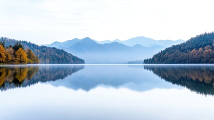 Serene lake mirroring mountains. Calm autumn colors reflected