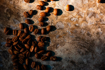 Coffee beans on concrete background.