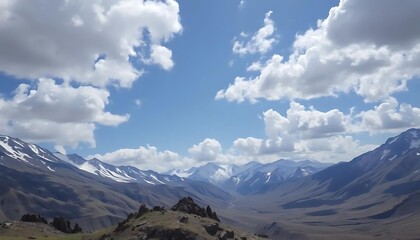 Fototapeta premium Majestic Peaks Under Azure Skies: A Breathtaking Mountain Vista with Snow Accents