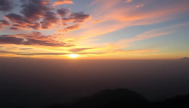 Captivating sunrise painting the sky above a sea of mist and distant peaks