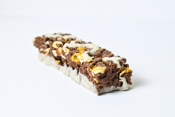 Close up view of Healthy Snack, Cereal Bar, Multigrain Bar with coffee extract isolated on white background. Tiramisu delight. Clipping path.