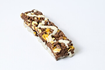 Close up view of Healthy Snack, Cereal Bar, Multigrain Bar with coffee extract isolated on white background. Tiramisu delight. Clipping path.