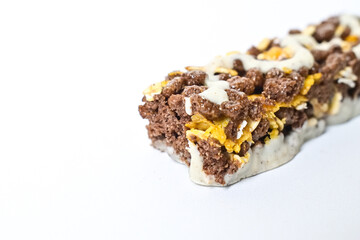 Close up view of Healthy Snack, Cereal Bar, Multigrain Bar with coffee extract isolated on white background. Tiramisu delight. Clipping path. Half view.