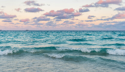 Sunset seascape at summer vacation. Sunrise with sea beach. Dramatic sunrise horizon at sea. Romantic summer vacation on sunset seascape. Sea sunset on ocean. Serene horizon