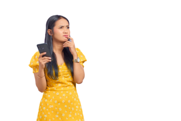 Portrait of pensive young Asian woman using a mobile phone and looking away isolated on transparent background