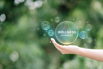 Health and wellness concept with glowing icons including fitness, and mental care, floating above a hand.