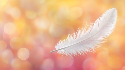 Naklejka premium Ethereal lightness: A delicate feather floating on a dreamy bokeh backdrop