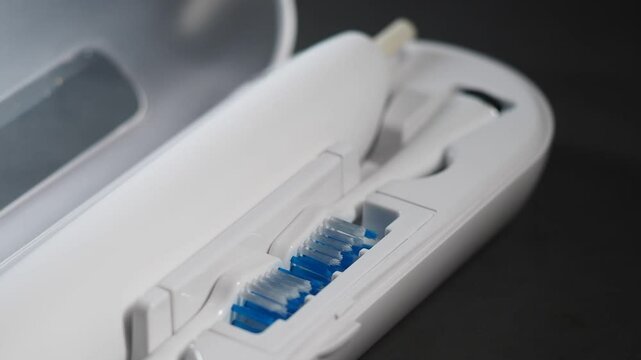 Toothbrush with replacement heads stored neatly in a compact case