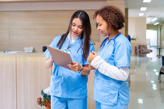 Team of diversity doctor and nurse is discussing and brainstorming on patient medical record after diagnosis for precise care plan with experienced physician specialist