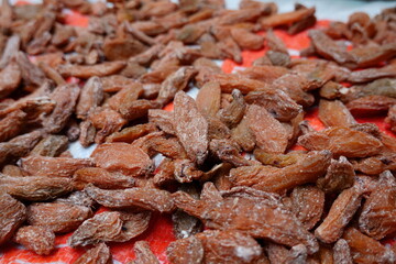 A detailed close-up of dried fruits spread out, showcasing their texture and vibrant colors