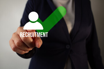 A woman is pressing a button that says 