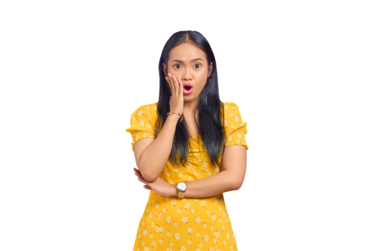 Portrait of shocked young Asian woman touching cheek with hands and open mouth isolated on transparent background