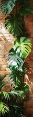 Large green tropical leaves cascading over a rustic brick wall soft natural light enhances the texture of the bricks and the vibrant greenery