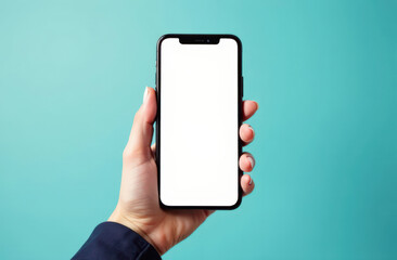 Female hand holding smartphone with blank screen against aqua background