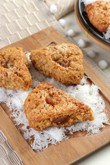 triangle shaped scone on wooden cutting board