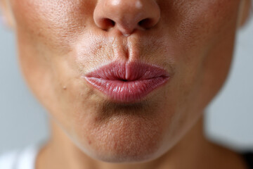 Female mouth puckering